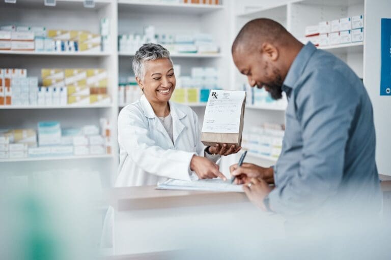 Pharmacist helping a male patient